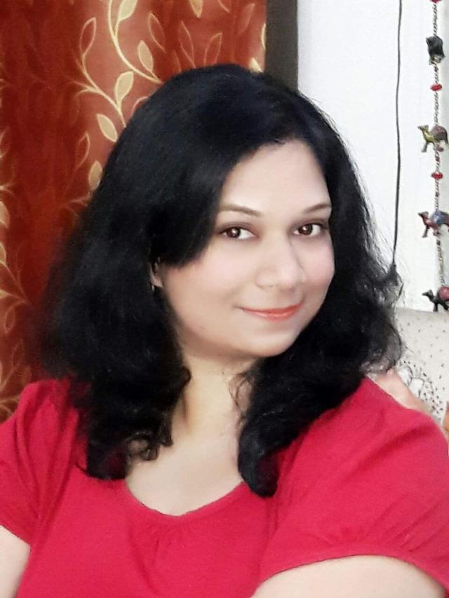 Dr. Aradhana Bhatnagar, astrologer in Gwalior, wearing a red saree