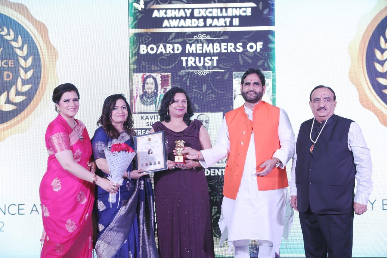 Award being presented on stage at the Akshay Excellence Awards ceremony